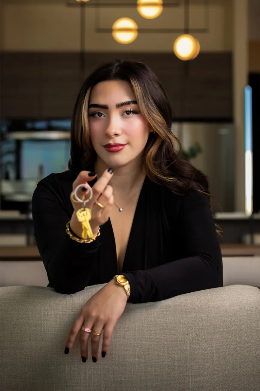 Ximena Martinez, REALTOR, holding a set of house keys